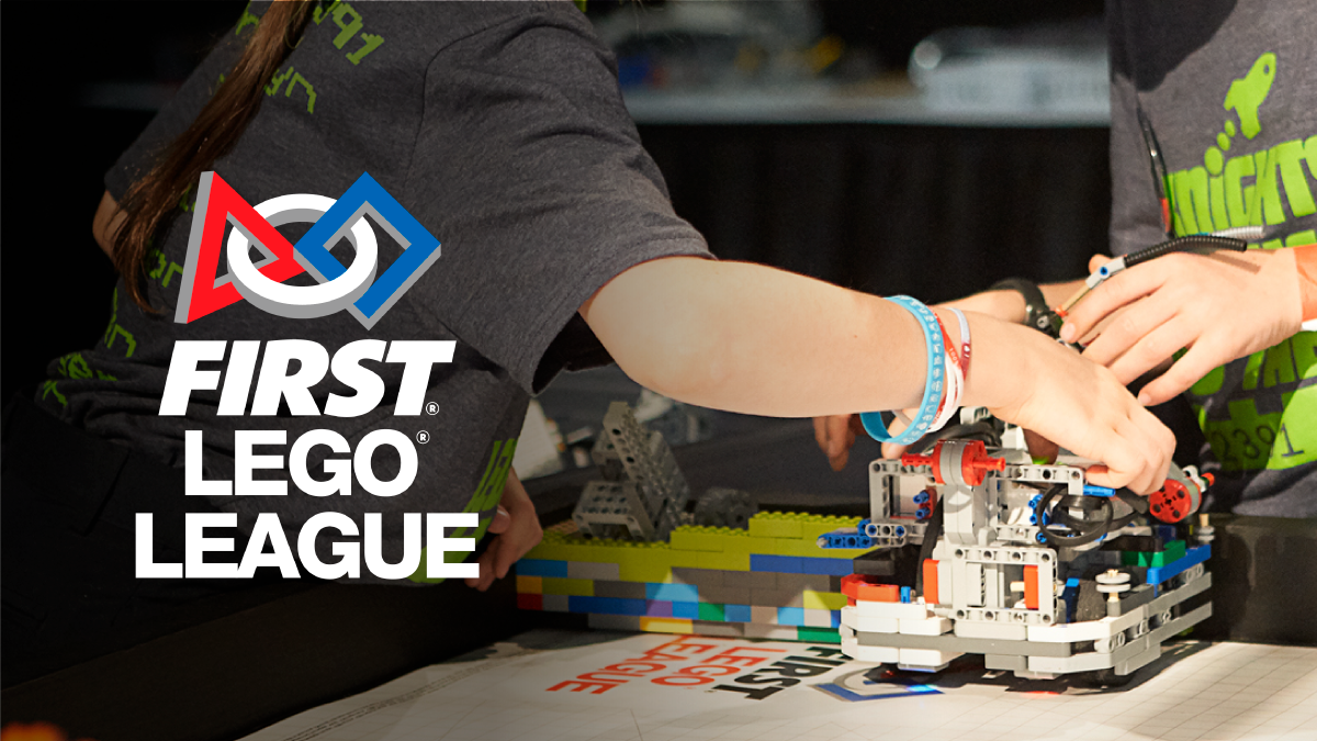 Close-up of two students building their FIRST LEGO League model